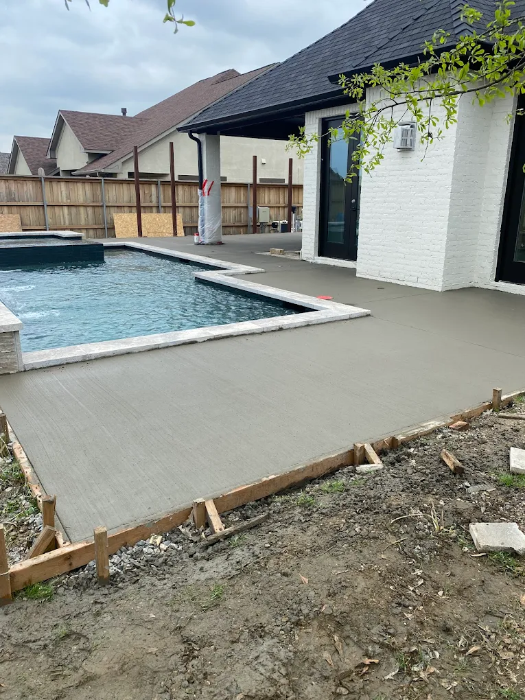 Backyard pool concrete area under active construction